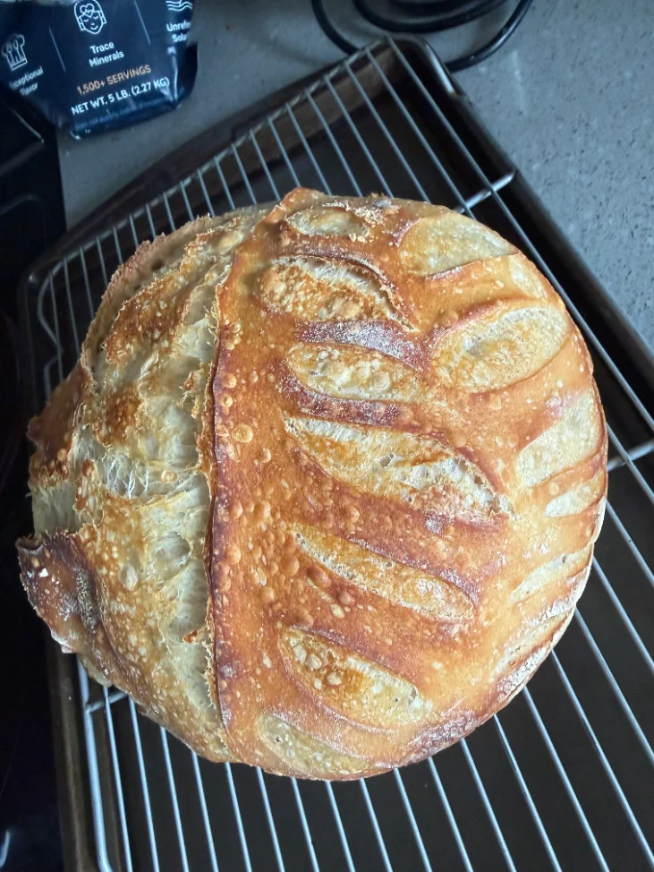 A sourdough loaf with a basket of eggs